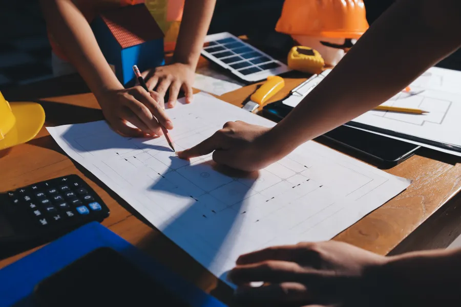 A group of people working on a project with construction tools